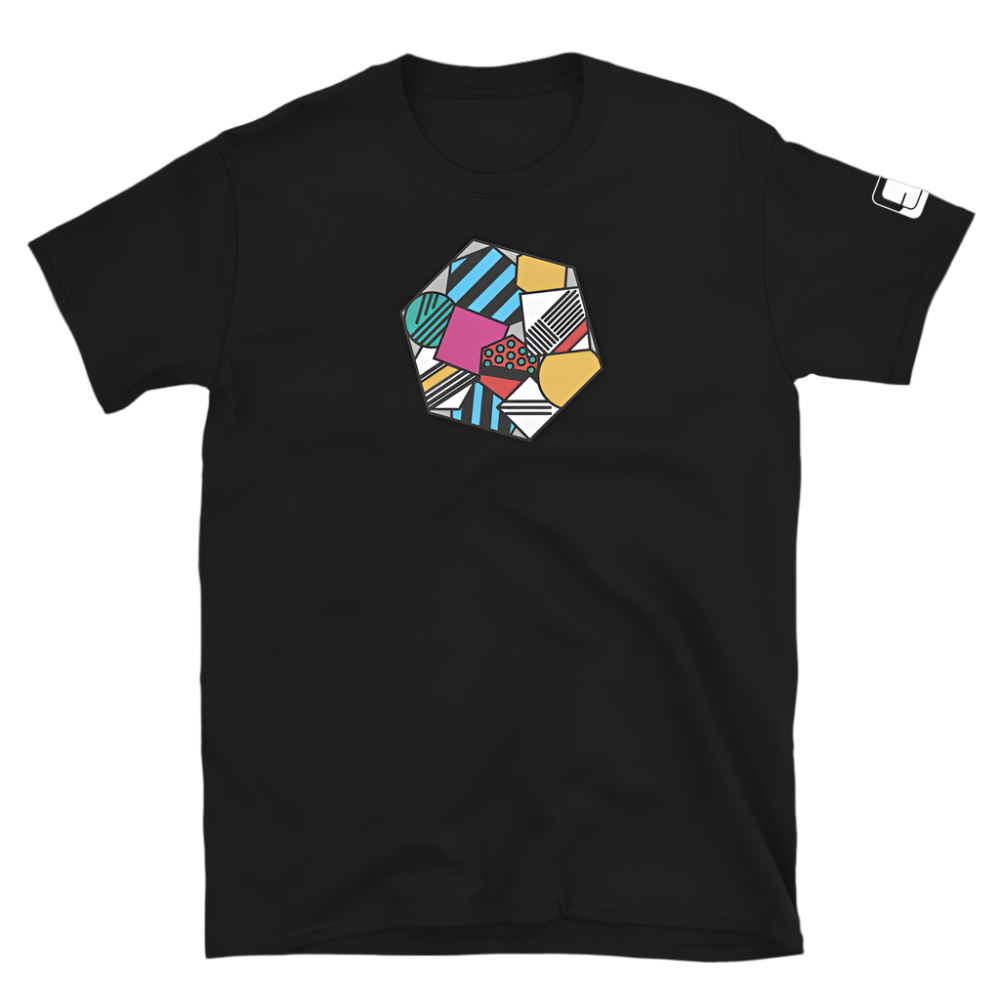 Black tee shirt featuring a colorful geometric pattern in a hexagon shape on the chest. The design mixes different textures and colors including blue, pink, yellow, and green with patterns like stripes and polka dots.