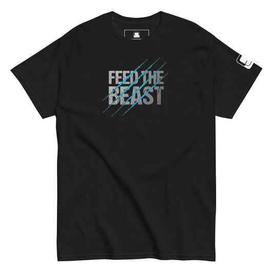 Black t-shirt with a graphic design featuring the phrase 'FEED THE BEAST' in large, distressed white and blue text, overlaid with diagonal blue scratch marks.