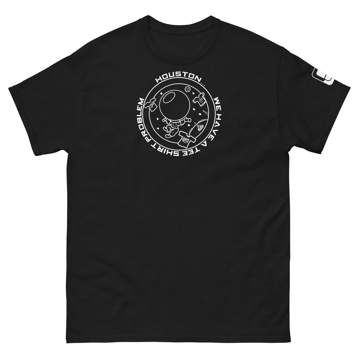 A sleek black t-shirt featuring a whimsical circular design that reads "Houston...we have a tee shirt problem," showcasing a floating astronaut and whimsical elements like floating t-shirts and a quirky UFO.