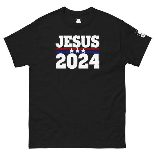 Black T-shirt with a political campaign style design featuring the text 'JESUS 2024' in bold white, red, and blue lettering. The design includes stars above the year to emphasize a patriotic theme.