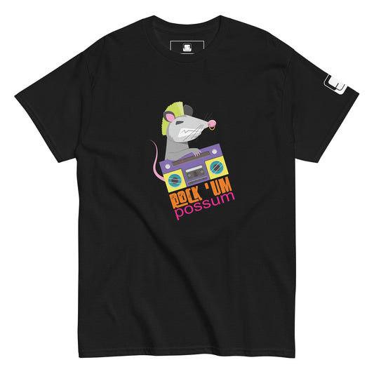  A black t-shirt displays a whimsical graphic featuring a gray possum with a bright green mohawk, energetically operating a purple and blue boombox. The possum, animated and cheeky, is depicted mid-dance. The phrase "ROCK 'UM POSSUM" in bold, multicolored letters adorns the bottom of the design, enhancing the rock and roll vibe of the shirt. The design offers a quirky mix of retro and contemporary styles, suitable for casual wear.