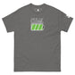 A charcoal gray t-shirt displays the phrase "FULLY LOADED" in bold black with white outlined lettering above a stylized green battery icon, indicating full charge. The graphic is centered on the chest, creating a striking visual contrast against the dark fabric. The design is modern and straightforward, catering to tech enthusiasts or anyone who appreciates a clever play on words with a clean aesthetic.