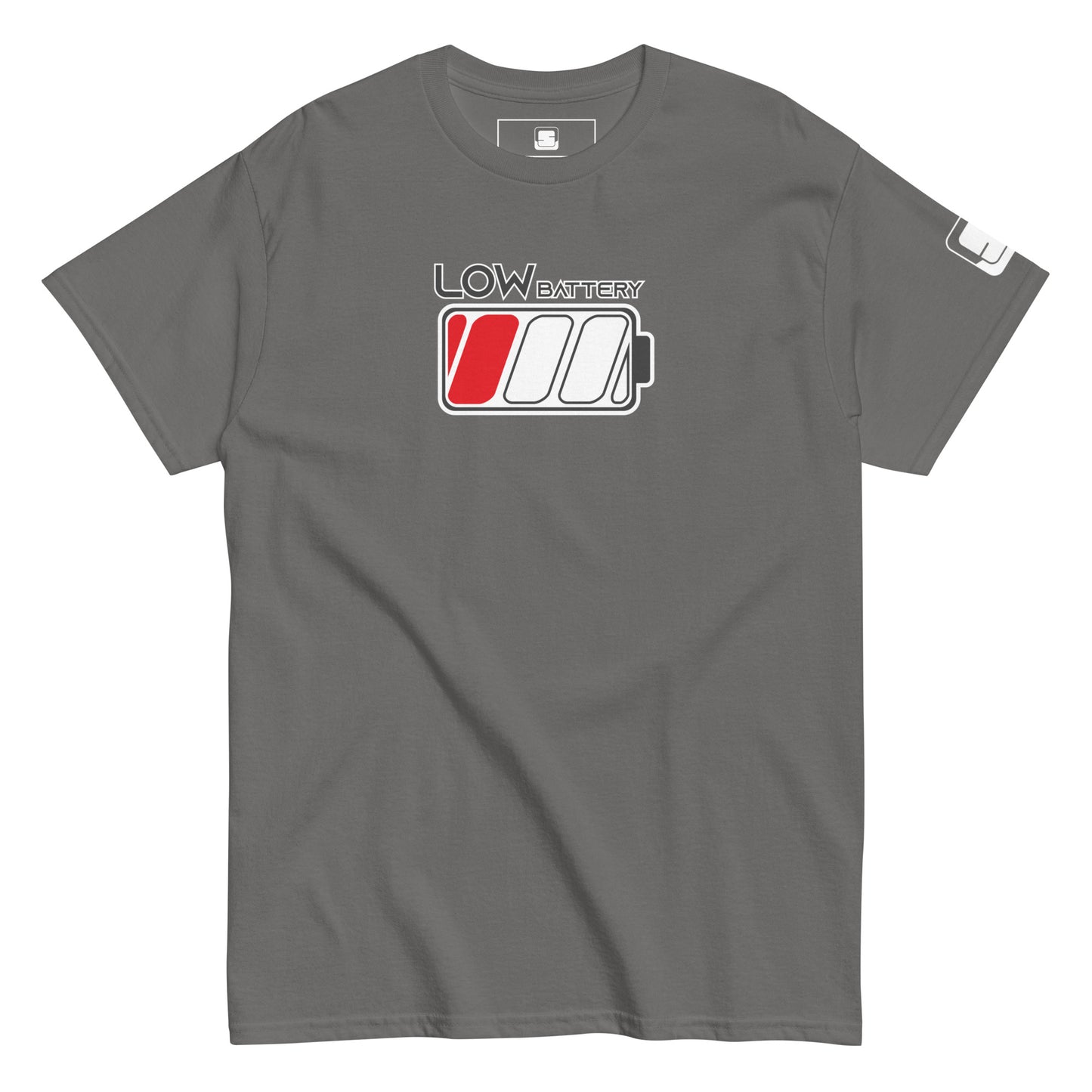 
A grey t-shirt features a "LOW BATTERY" graphic on the chest in grey lettering with a white outline. Below the text, there's a stylized battery icon with three sections; the first cell is filled in red, indicating a low charge level. The t-shirt has a regular fit, a ribbed crew neckline, and short sleeves, with a small black logo patch on the right sleeve, adding a subtle detail to the simple design.