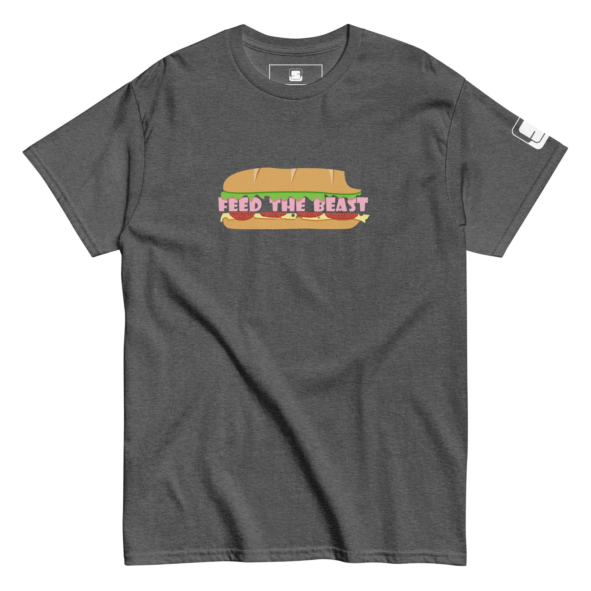 Dark gray t-shirt displaying a playful graphic of a sandwich with the text 'FEED THE BEAST' cleverly integrated as part of the sandwich filling. The graphic uses warm earthy colors, making it pop against the gray fabric of the shirt."