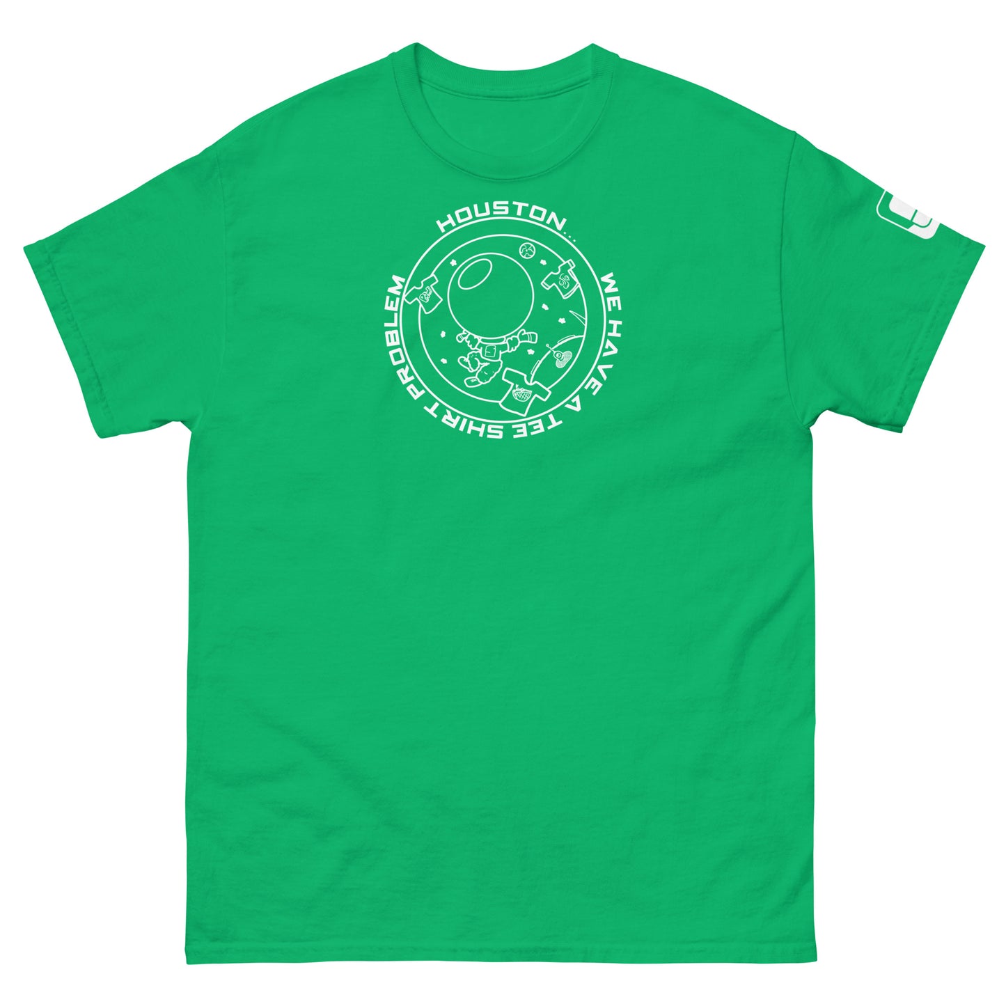 A vibrant green t-shirt that catches the eye with its large white graphic that humorously states "Houston...we have a tee shirt problem," surrounding a floating astronaut and playful space motifs including t-shirts, designed to capture the spirit of space exploration.