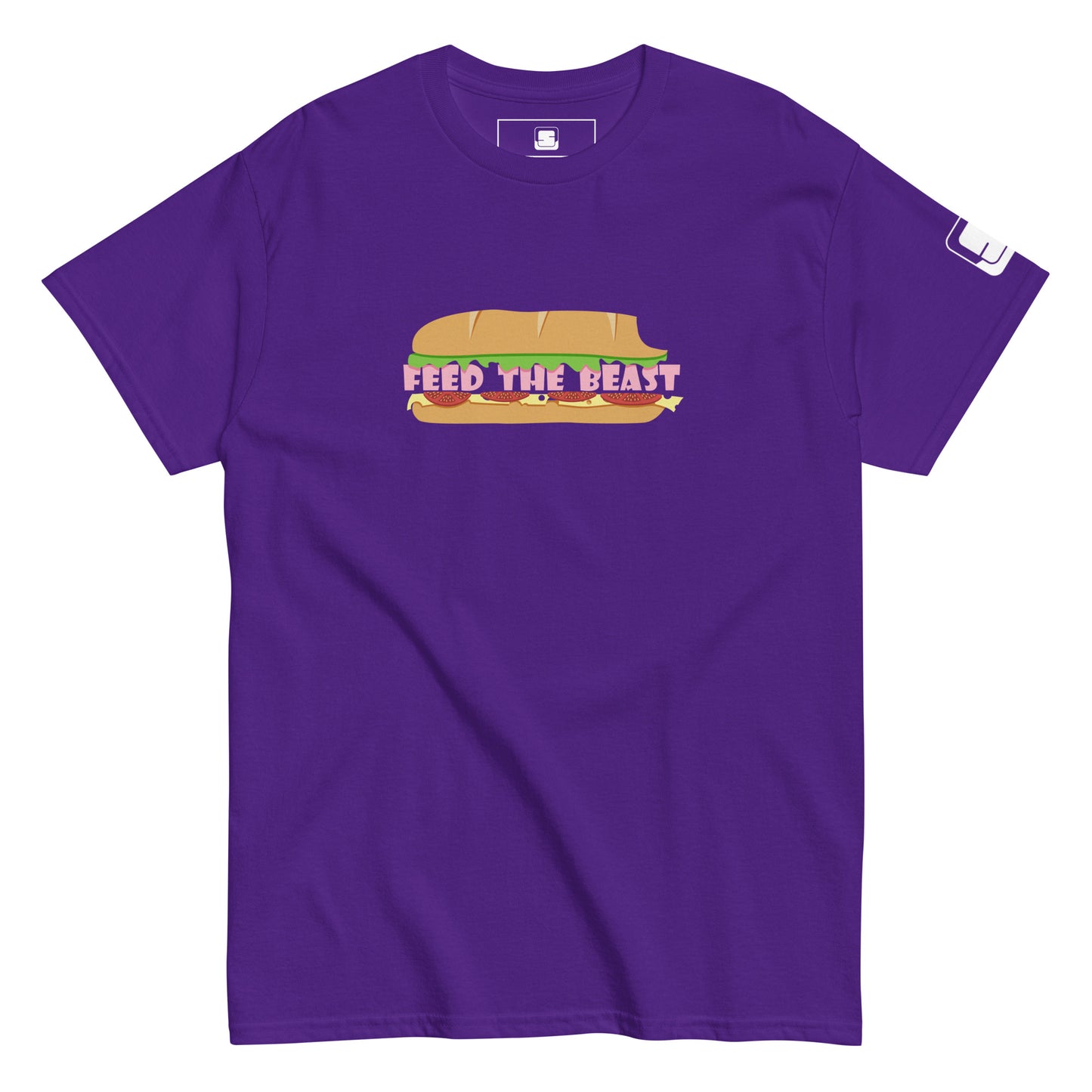 Vibrant purple t-shirt featuring a colorful 'FEED THE BEAST' sandwich graphic design. The design showcases a sandwich in earthy tones with pink lettering integrated creatively to represent the sandwich filling, giving it a playful and eye-catching appearance.