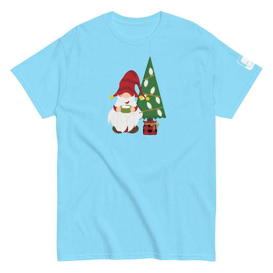 Light blue classic tee featuring a playful Christmas gnome holding a steaming mug of hot chocolate, standing next to a decorated Christmas tree in a plaid tree stand.