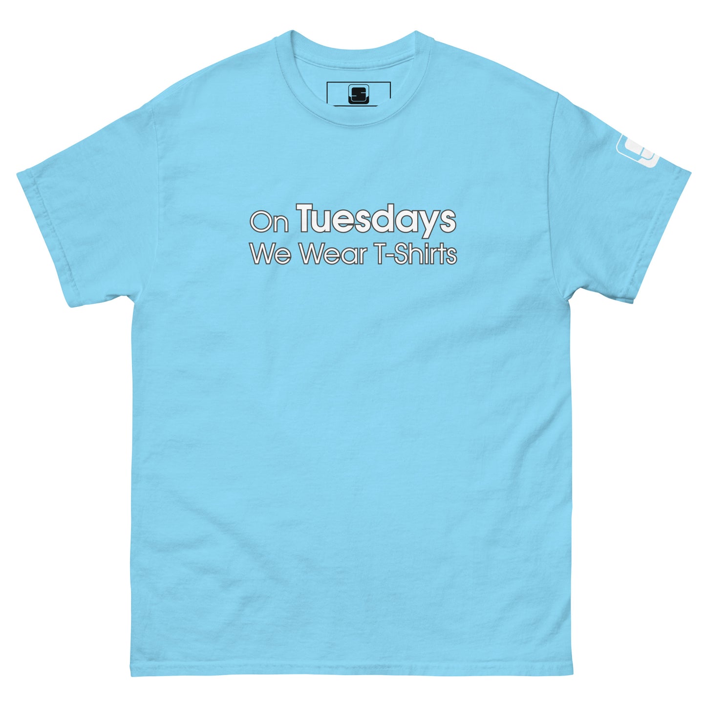 A light blue t-shirt displayed flat, featuring the phrase "On Tuesdays We Wear T-Shirts" in white uppercase letters across the chest. The shirt maintains a relaxed fit with a classic crew neckline and short sleeves. A small logo patch is subtly placed on the left sleeve, enhancing the casual, thematic appeal of the shirt.