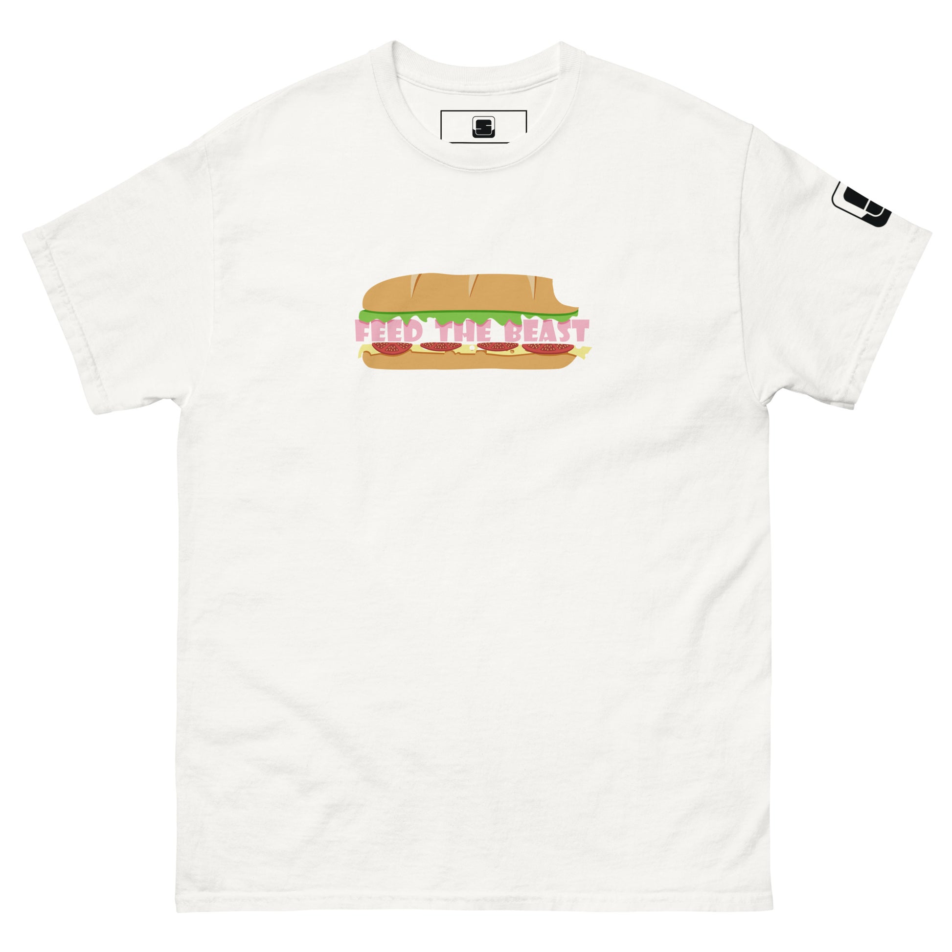 Plain white t-shirt featuring a colorful, fun graphic of a sandwich with the phrase 'FEED THE BEAST' represented in stylized, bold letters as the filling. The playful design uses vibrant shades of yellow and pink to highlight the text and the sandwich on the fabric.