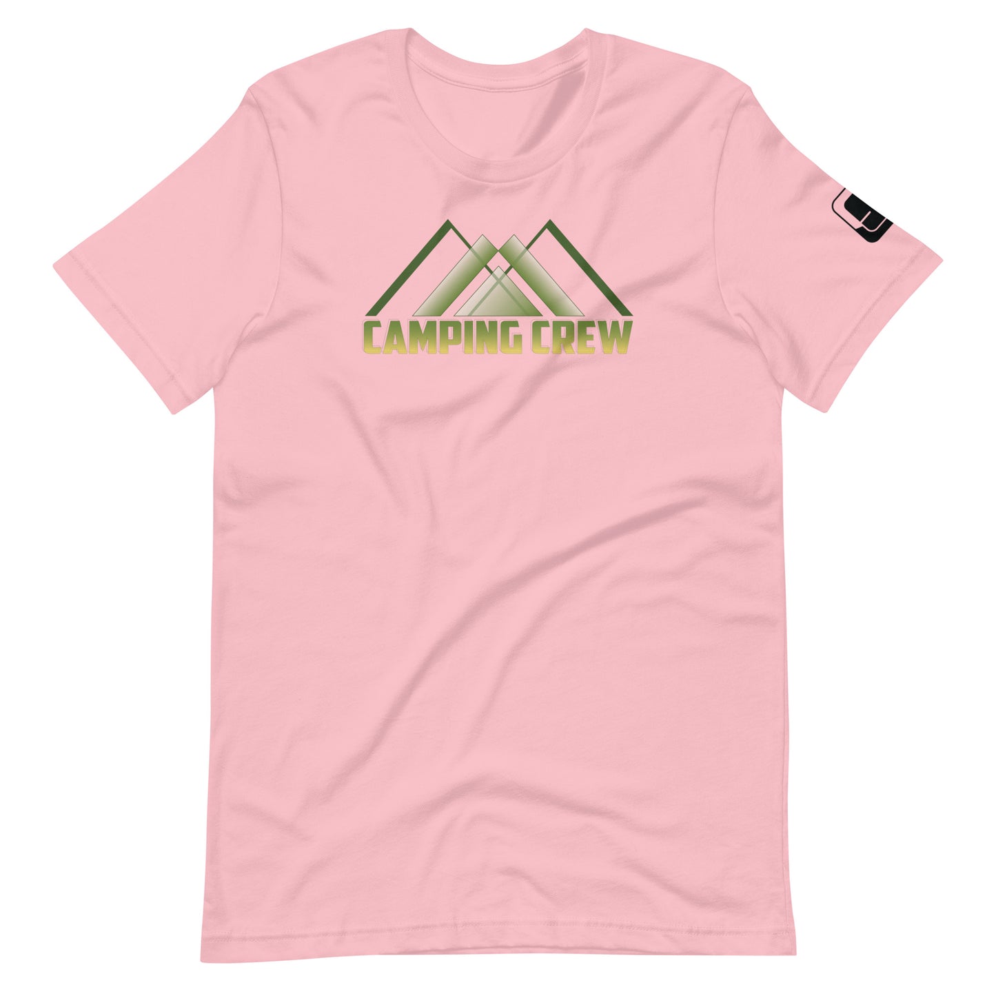 A soft pink t-shirt showcases the 'CAMPING CREW' design in green, featuring stylized lettering with an abstract, geometric mountain motif positioned above the text. This design caters to those who enjoy the camaraderie and adventure of outdoor activities.