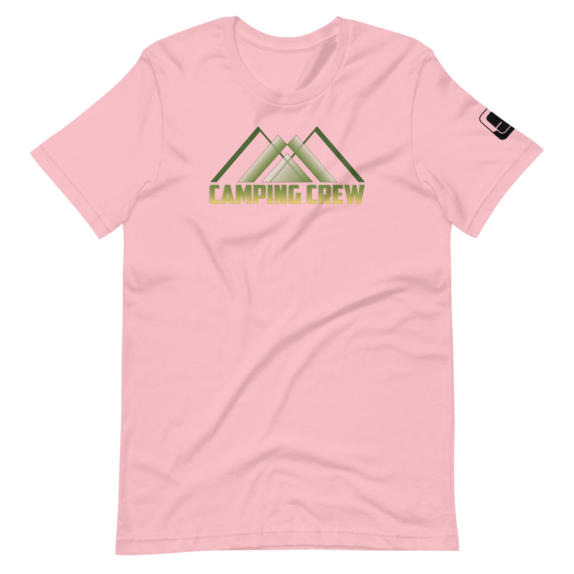 A soft pink t-shirt showcases the 'CAMPING CREW' design in green, featuring stylized lettering with an abstract, geometric mountain motif positioned above the text. This design caters to those who enjoy the camaraderie and adventure of outdoor activities.