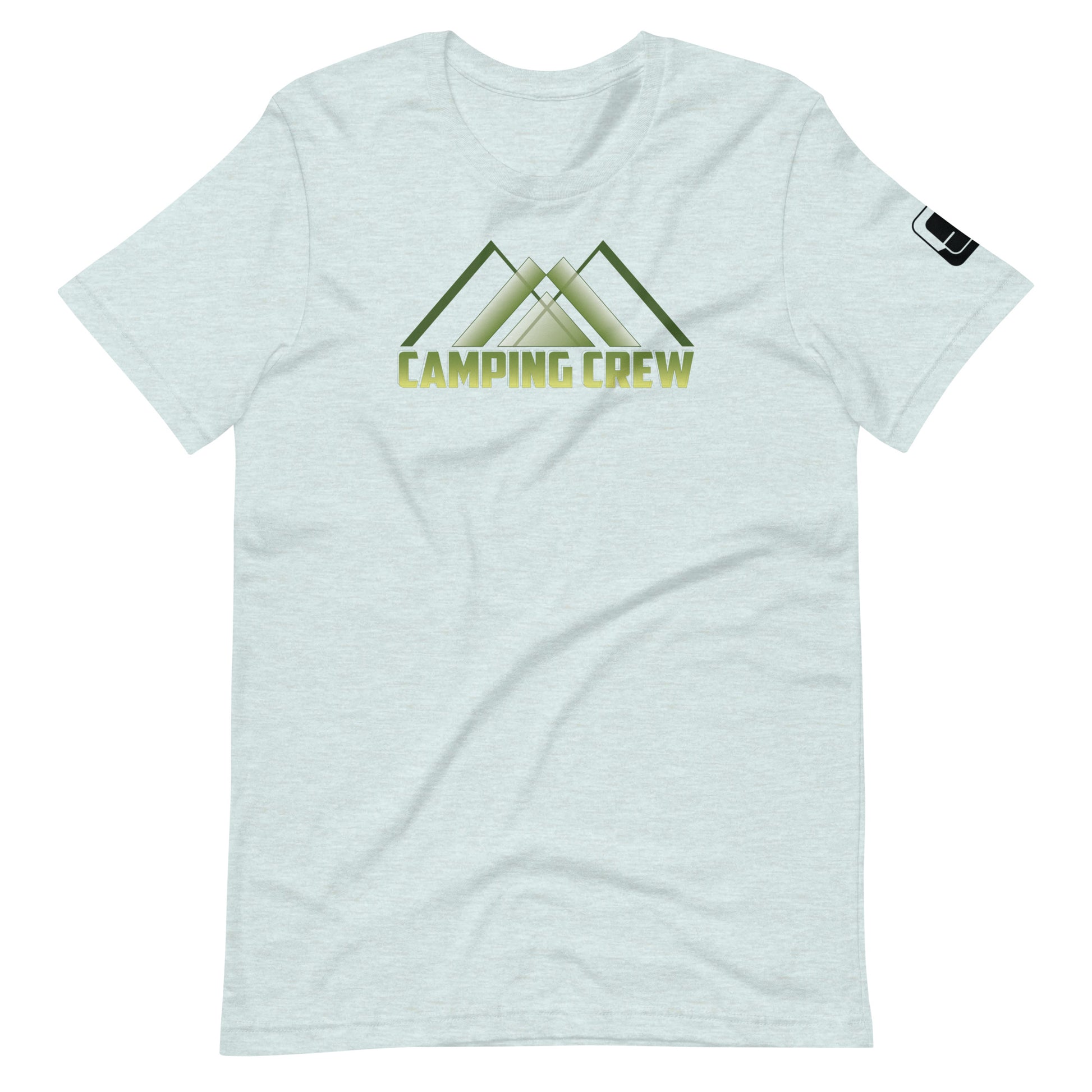 A light blue-grey t-shirt features a minimalistic design with the phrase 'CAMPING CREW' in bold, green lettering. The design is stylized to include an abstract representation of mountain peaks, suggesting a love for outdoor activities and nature. This simple yet expressive design is ideal for those who enjoy the camping lifestyle.