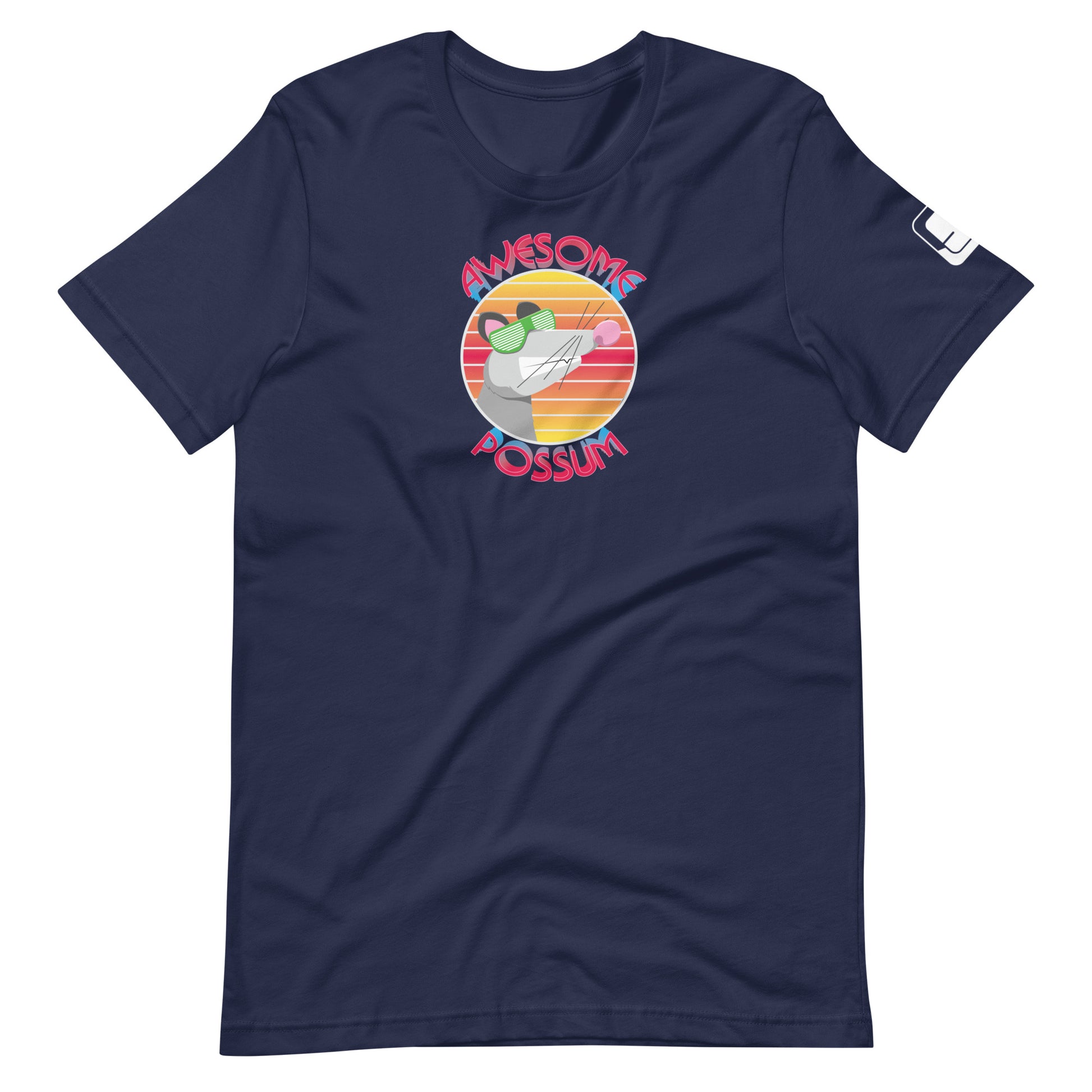 
A navy blue t-shirt featuring a playful graphic with the text "AWESOME POSSUM" around a stylized illustration of a possum wearing green sunglasses. The possum is set against a colorful circular backdrop resembling a sunset in shades of pink, orange, and yellow. The design combines fun and casual style, perfect for a relaxed and quirky look.