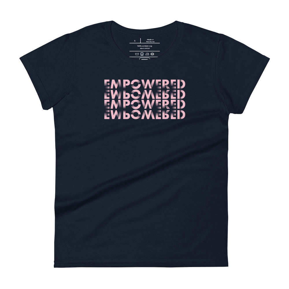 A navy blue t-shirt featuring a cleverly designed graphic that displays the word "EMPOWERED" four times, forming a three-dimensional cube illusion. The design uses a lighter pink color for the text, creating a striking contrast against the dark shirt background. This bold and modern typography emphasizes empowerment in a visually engaging way.